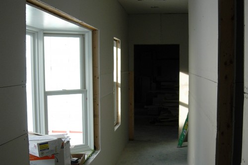 unfurnished hallway during build project by allied contractors