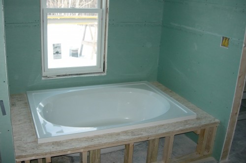 bathroom remodeling tub and green window installation in home build project in central vermont by allied contractors