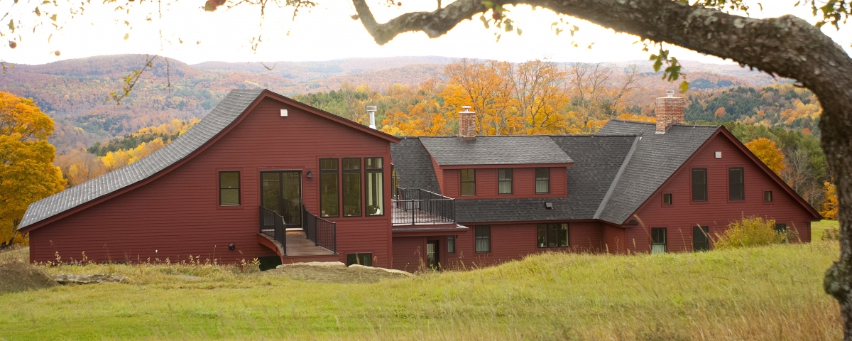 Red sprawling house in central vermont after full remodeling project by Allied Building contractors