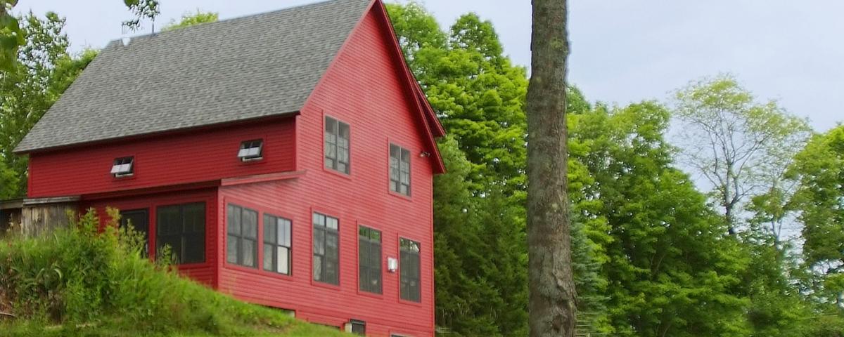 A red two story house in Central Vermont after a full remodel