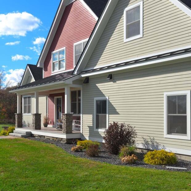 side view of the exterior of red and beige home