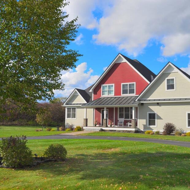 front exterior of a red and beige home