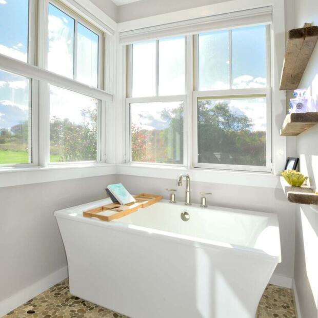 white porcelain tub with bright natural light