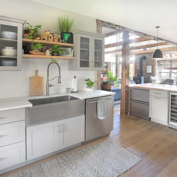 kitchen sink and cabinets with area rug