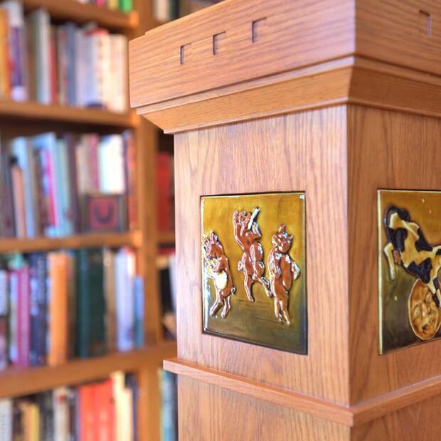 artistic tile detailing on wood staircase