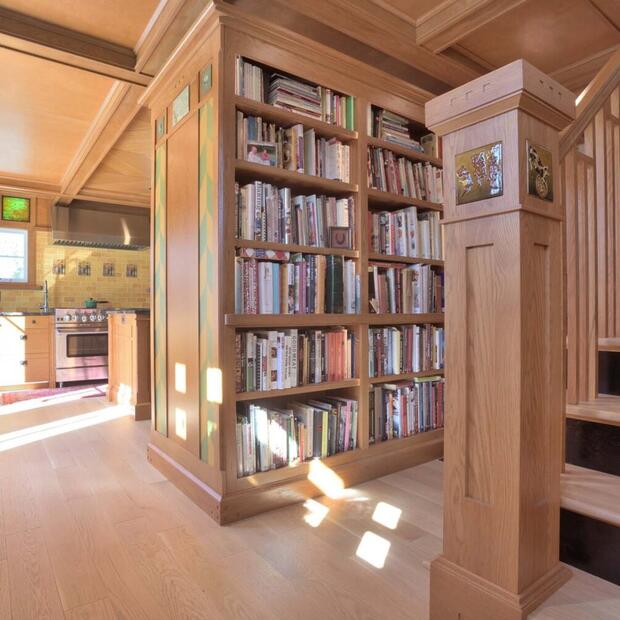 built-in floor to ceiling wood bookshelves