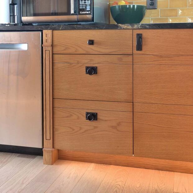 wood cabinets with dark hardware