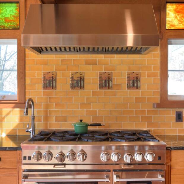 gas stove with tile backsplash