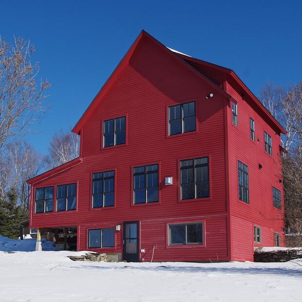 red home on a winter day with blue sky