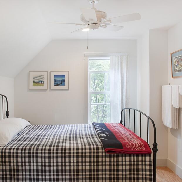 side view of bedroom with bed and window