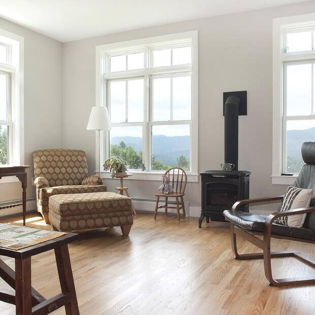 modern living room with arm chair and woodstove