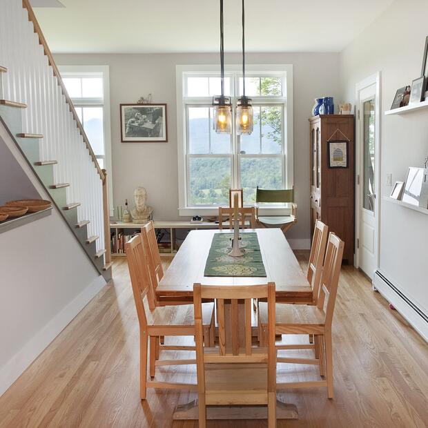 dining room with long dining table and large windows