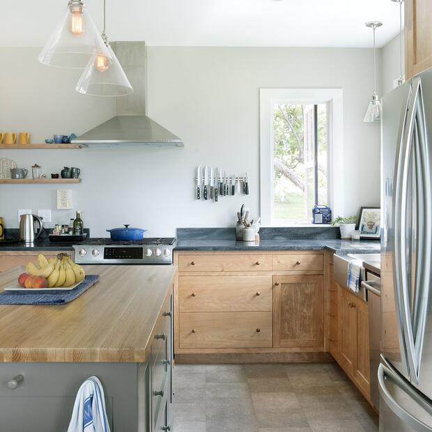 side view of modern kitchen with wood cabinets