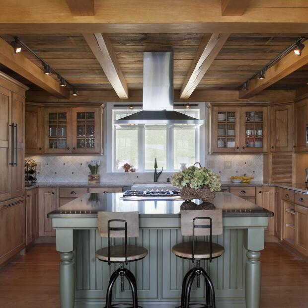 kitchen with farmhouse charm, featuring a beamed ceiling and elegant finishes